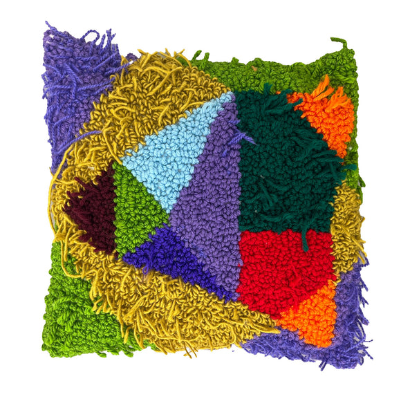 This textile piece showcases a patchwork of vividly colored yarns in a variety of textures, from densely woven areas to sections with loose, shaggy threads. The composition's geometric arrangement and contrasting hues create a dynamic visual interplay, emphasizing tactile variation and the craft's layered, handmade quality.