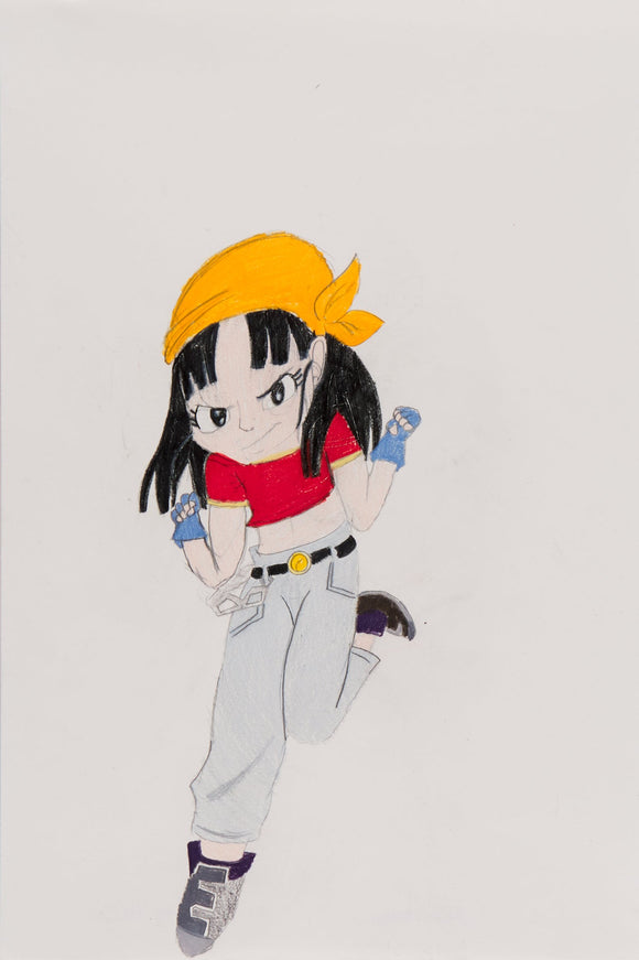 ‘Pan Prepares to Fight’ is a colored pencil on paper artwork that measures 18 x 12”. As the title suggests, it features Pan, a character from the Dragon Ball series with clenched fists, prepared to fight. Her gaze is fixated at the viewer as if inviting them to a challenge. Pan is recognized through her shoulder length black hair, her red crop top, and her orange bandana that rests on her head. She wears fingerless gloves and dark gray boots. She is the sole focus of the composition, with no other details.