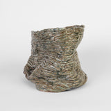Continuous Touch by Ericka Lopez features 21 coiled ceramic vessels in a variety of sizes and colors. Ranging from bright, fiery red to cool, deep purple, the highly tactile works are glazed with both matte and glossy finishes. While each is unique, this body of work is unified by organic, flowing contours that render distinct silhouettes on all sides of the pieces. The artist encourages you to touch lightly for the most comprehensive experience.