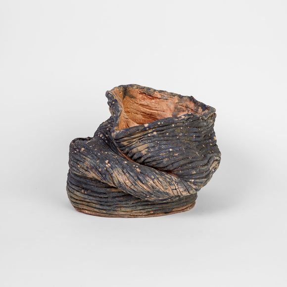 Continuous Touch by Ericka Lopez features 21 coiled ceramic vessels in a variety of sizes and colors. Ranging from bright, fiery red to cool, deep purple, the highly tactile works are glazed with both matte and glossy finishes. While each is unique, this body of work is unified by organic, flowing contours that render distinct silhouettes on all sides of the pieces. The artist encourages you to touch lightly for the most comprehensive experience.