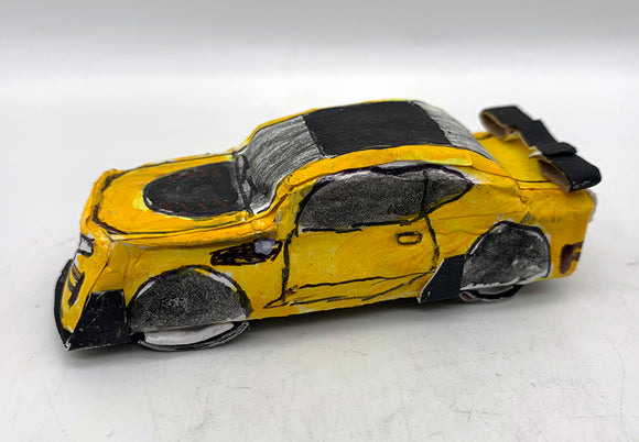 Angel Rodriguez - Untitled (yellow and black race car)