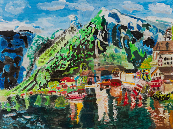 This is a 9 by 12-inch acrylic painting of a lake town nestled in a mountainous region titled “Hallstatt in Austria.” The mountain has shades of black, green, and blue with white accents. The town is full of contrasting colors with hues of reds, browns, and whites. Both the mountains and the town reflect off the water’s surface at the bottom of the canvas. 